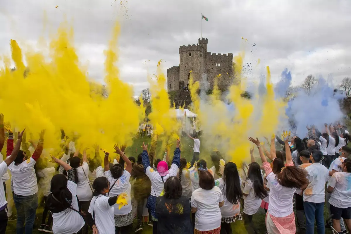 A group of South Asian people celebrating Holi