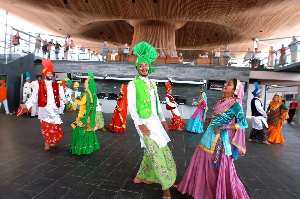 South Asian dancers dancing outside the Senedd building