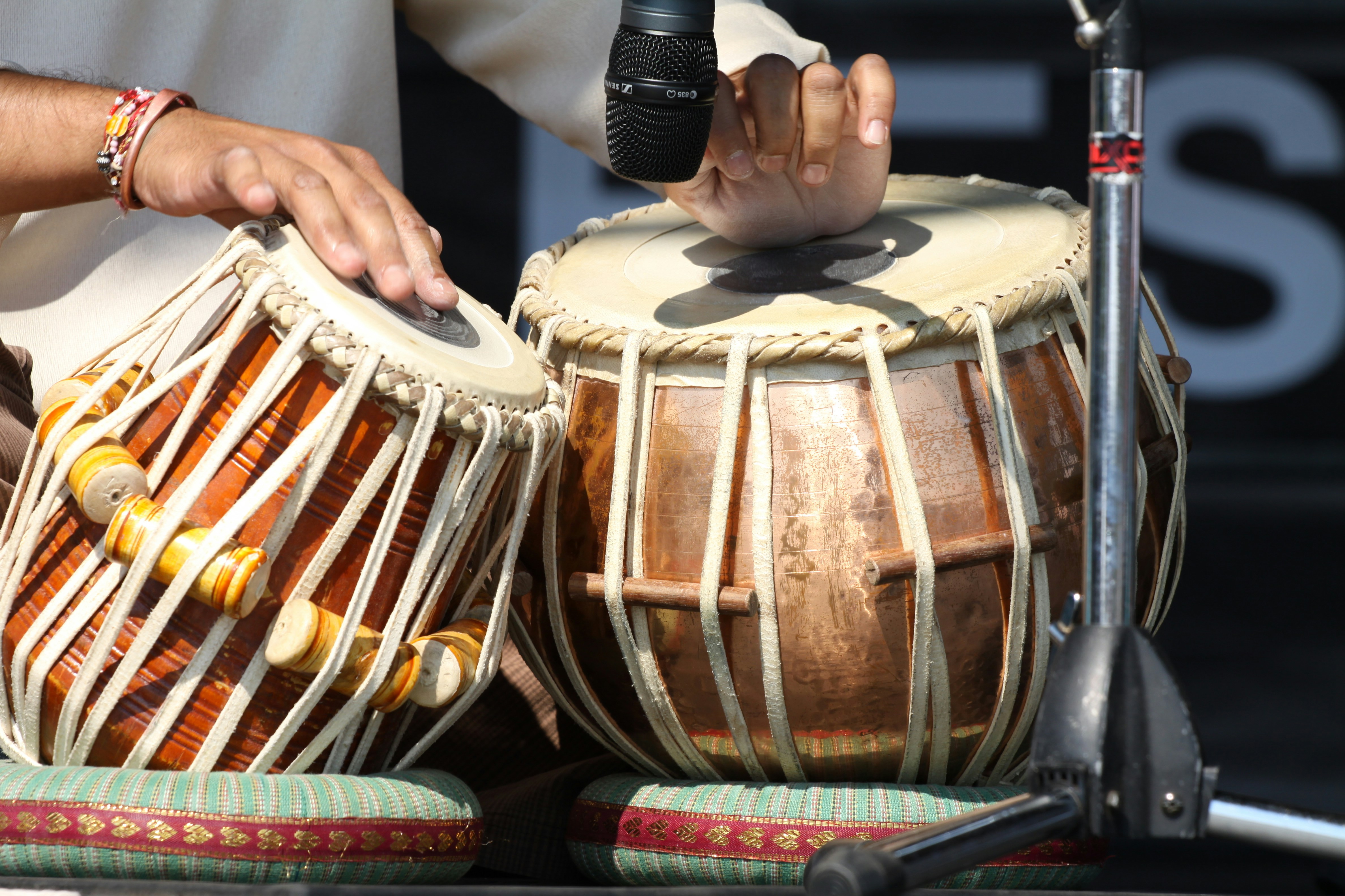 Traditional South Asian drum being played by someone